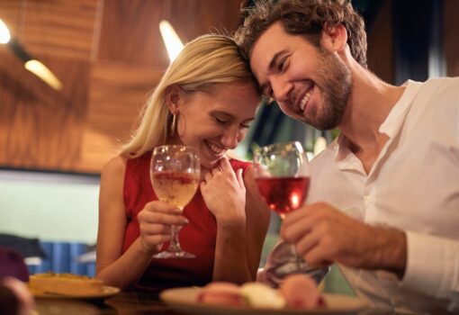 A young couple in romantic moments at Valentine's day celebration in restaurant in a relaxed atmosphere. Together, Valentine's day, celebration