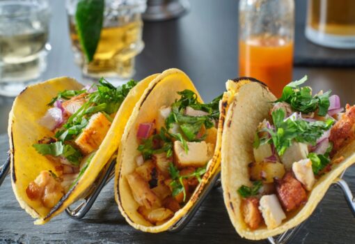 Tasty grilled pineapple and chicken street tacos in metal tray